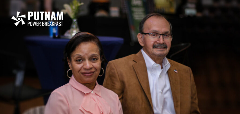 Putnam Power Circle. African American woman in a pink blouse and a Hispanic main a white dress shirt and sport coat at a Putnam event.
