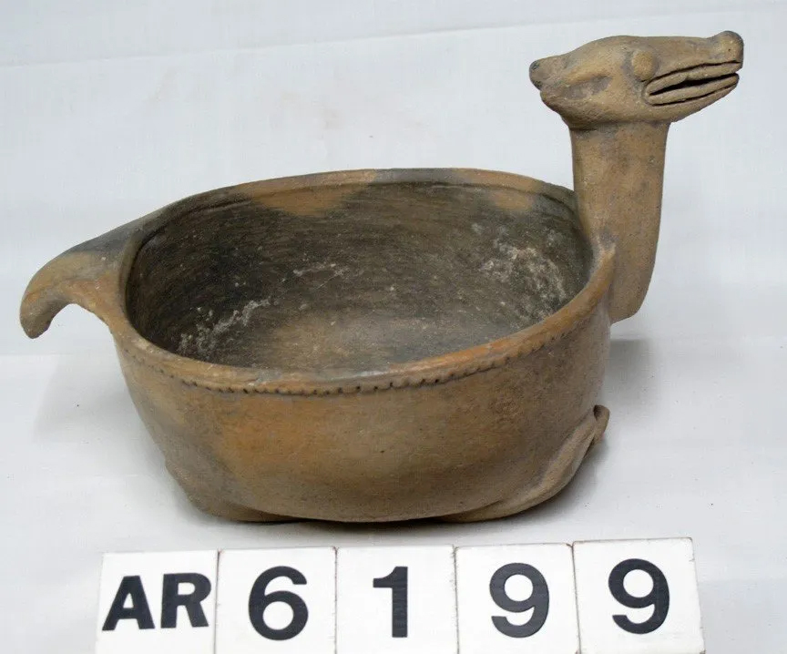 Historic stoneware bowl with an animal head and tail
